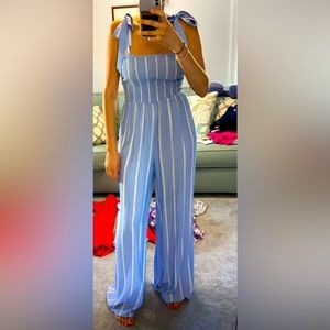 Beautiful H&M blue and white jumpsuit. wide leg and bows on shoulders. Size 6